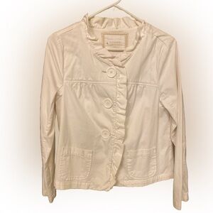 Sweet and pretty ruffled white jacket perfect for a summer party.